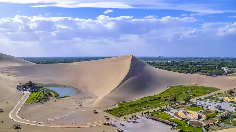 International media visits Cresent Moon Lake, Mingsha Mountain Scenic area in Dunhuang, China